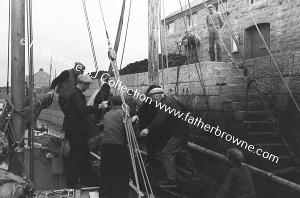 BOATS AND BOATMEN WITH LIFEBOAT TO INNISHMAAN CASHLA BAY  FR KILLEAN PP AND FR KEANE S.J.